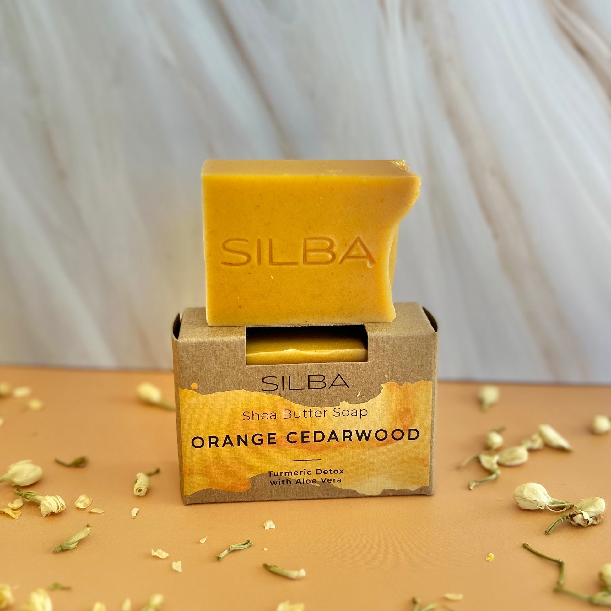 Orange Cedarwood Soap in full bar size in soap box and half bar size